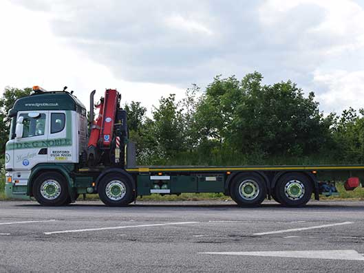 Small crane offload vehicle