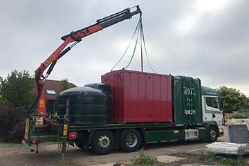 Small crane offload on site